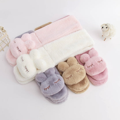 Children's warm pink plush bunny scarf, featuring a playful bunny design for winter comfort.
