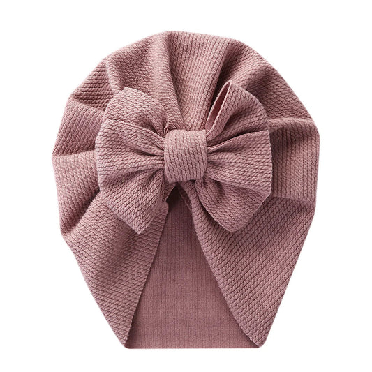 Soft pink topknot turban hat for infant, stretchy polyester baby headwrap fashion accessory