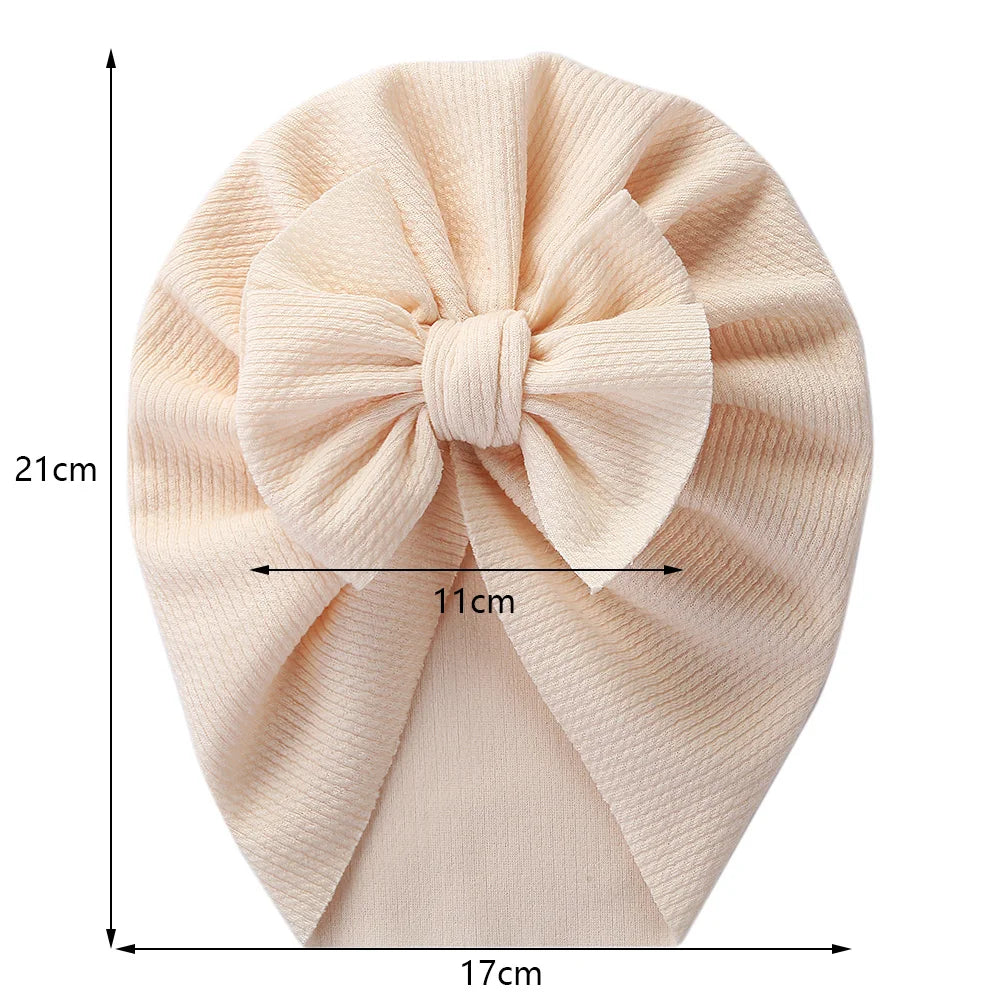 Stylish blue baby headwrap with topknot detail, soft polyester toddler accessory