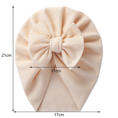 Stylish blue baby headwrap with topknot detail, soft polyester toddler accessory