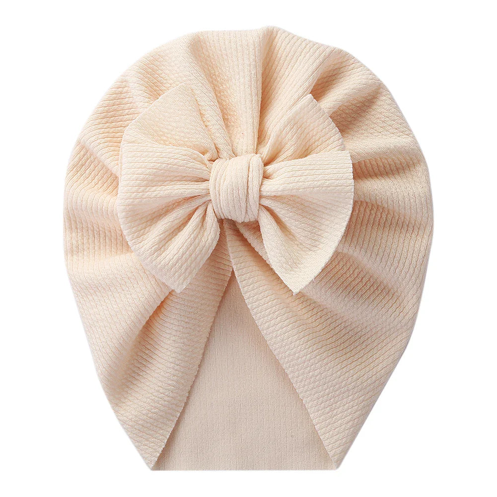 Newborn essentials: cream baby topknot turban, gentle polyester infant hat