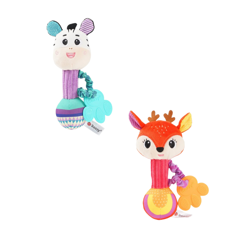 Baby holding and playing with a plush lion animal rattle, developmental toy