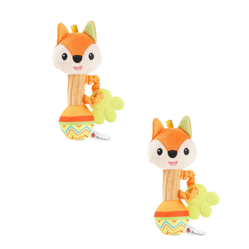 Infant reaching for a colorful plush giraffe baby rattle, sensory engagement