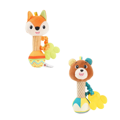 Newborn looking at a soft cotton animal rattle, gentle sensory toy