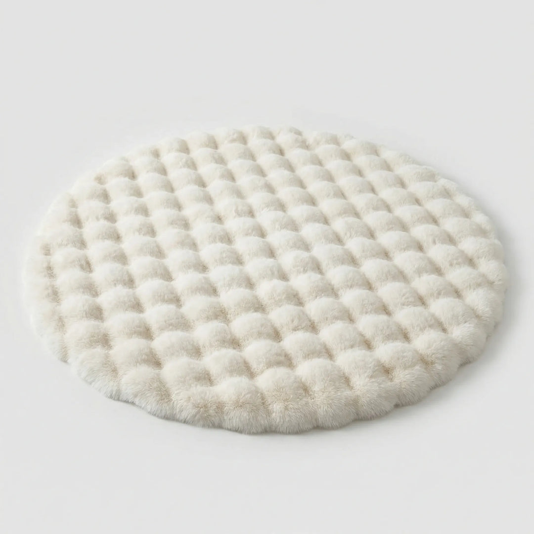 Cozy round plush bedroom rug. The soft "Flowique" tufted design adds warmth and comfort to your bedroom decor.