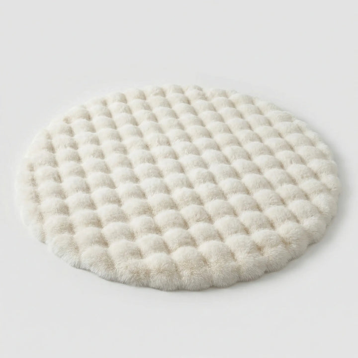 Cozy round plush bedroom rug. The soft "Flowique" tufted design adds warmth and comfort to your bedroom decor.