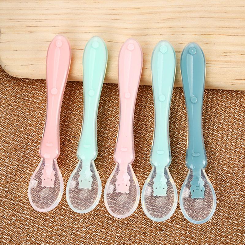 Set of colorful silicone baby feeding spoons, designed for young children learning to self-feed. Perfect first spoon.