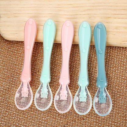 Set of colorful silicone baby feeding spoons, designed for young children learning to self-feed. Perfect first spoon.