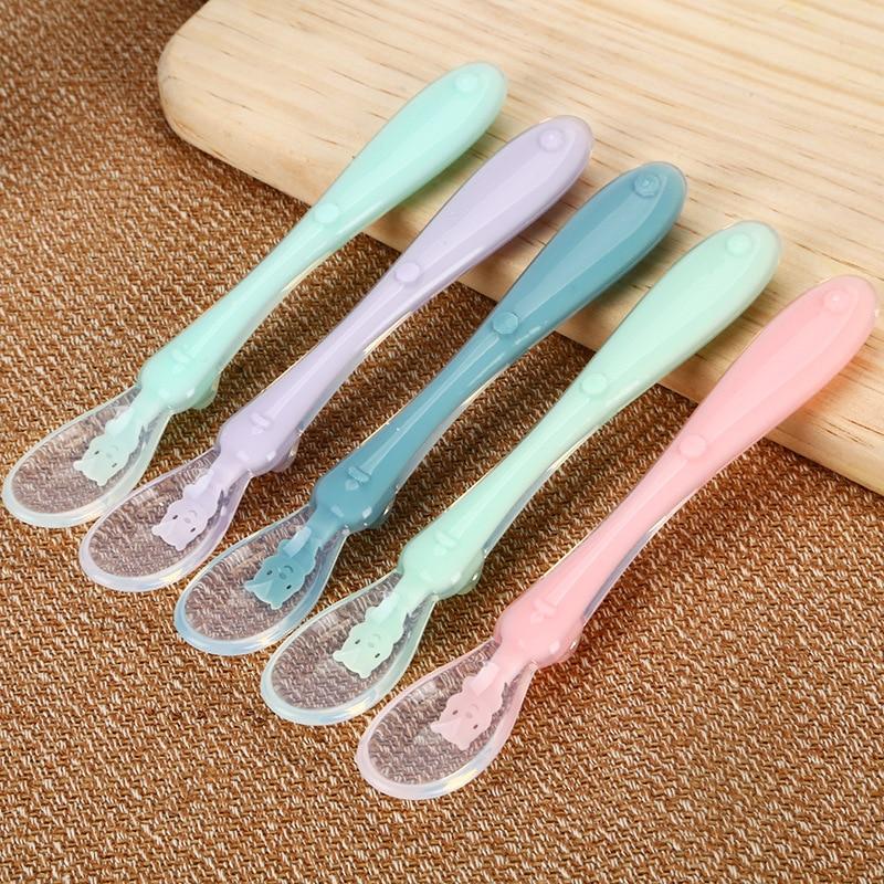 Close-up of flexible silicone tip of baby spoon, ideal for sensitive gums during infant mealtime and feeding.