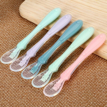 Close-up of flexible silicone tip of baby spoon, ideal for sensitive gums during infant mealtime and feeding.