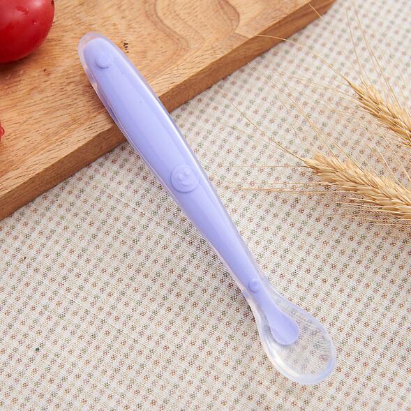Detailed view of the small, gum-friendly bowl of a silicone baby spoon, perfect for first foods and self-feeding.