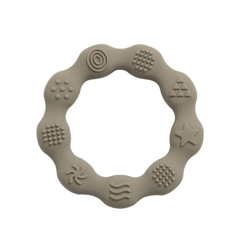Infant silicone teether with integrated grip handle, promoting self-soothing ability