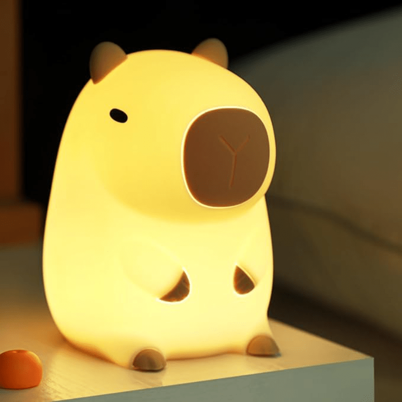 Handheld soft silicone night light for kids, a portable sleep companion with gentle glow.