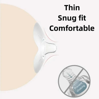 View of two transparent silicone nipple shields on a clean surface, for nursing pain relief.