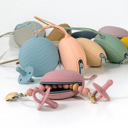 Close-up of a textured silicone pacifier holder, highlighting its soft and safe material for infants.