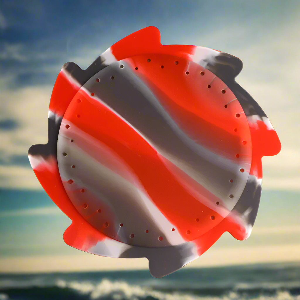 Soft silicone water frisbee, green, soaring through the air in a park, perfect for kids and beach toy fun