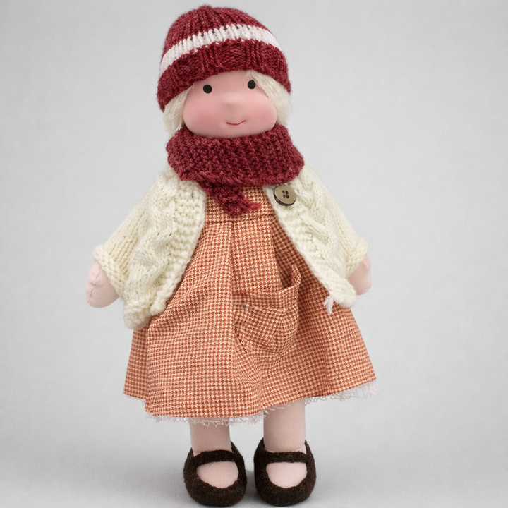 Waldorf wool doll, soft & handmade, natural materials, perfect for imaginative child play.