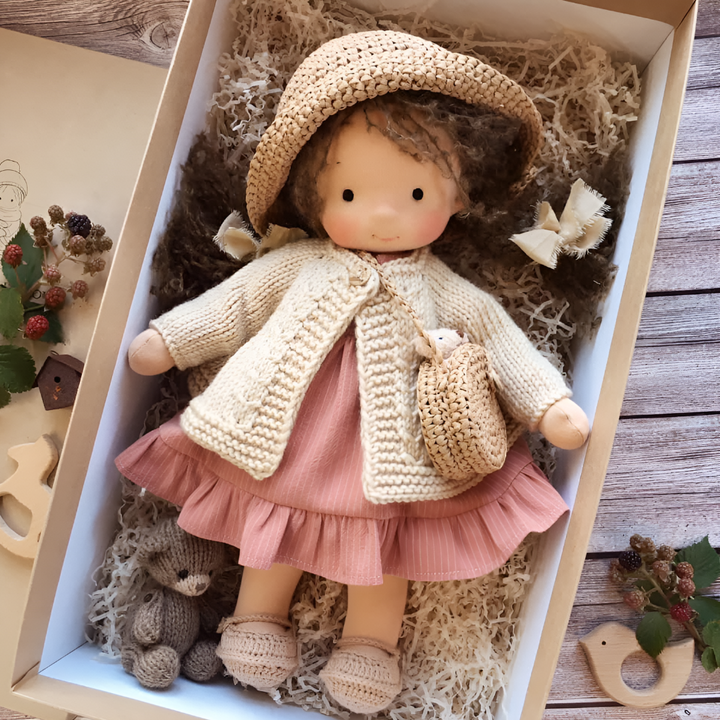 Children's handmade Waldorf doll, soft cloth, natural materials for creative play fun.