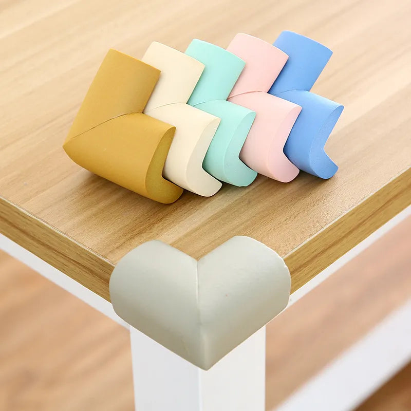 Soft white baby safety corner guards for child proofing furniture edges, preventing toddler injuries.