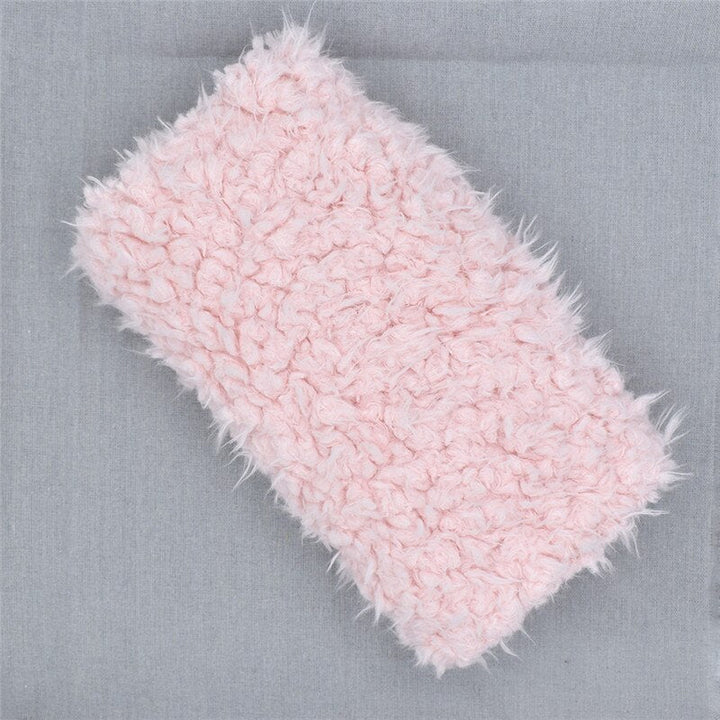 Versatile faux fur newborn receiving blanket, also a plush photography prop for cozy infant photo shoots.
