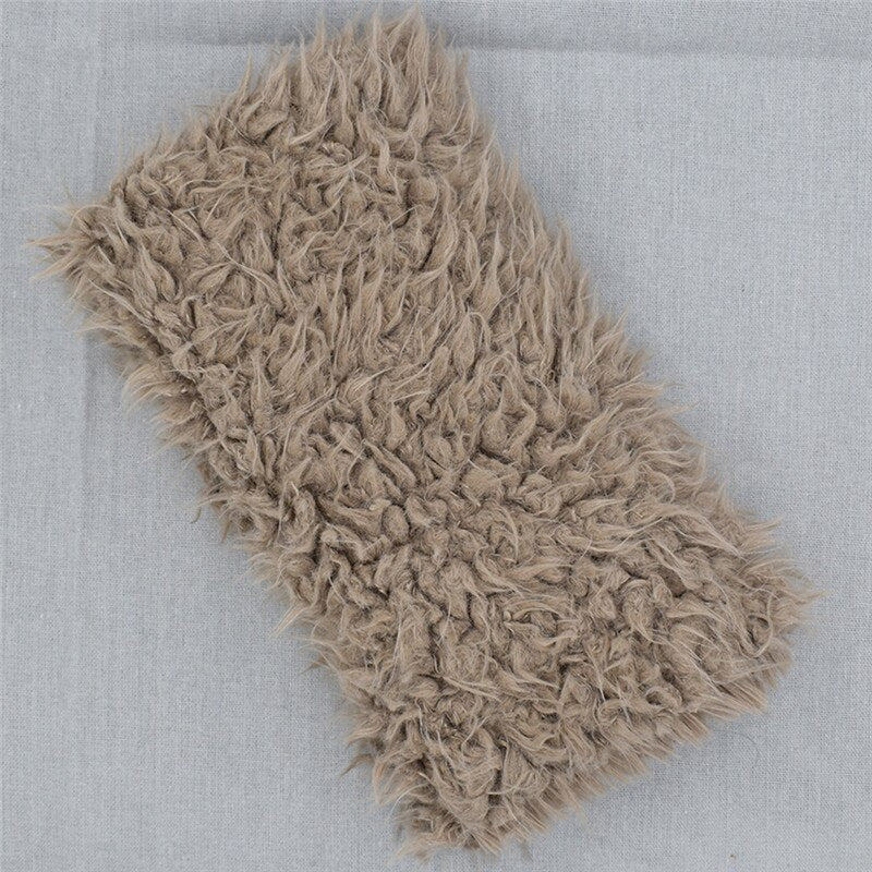 Elegant faux fur newborn photography prop blanket. Soft, plush baby accessory for beautiful infant photo shoots.