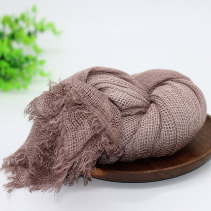 Pink knit newborn swaddle blanket, a cozy baby accessory and adorable photo prop for infants.