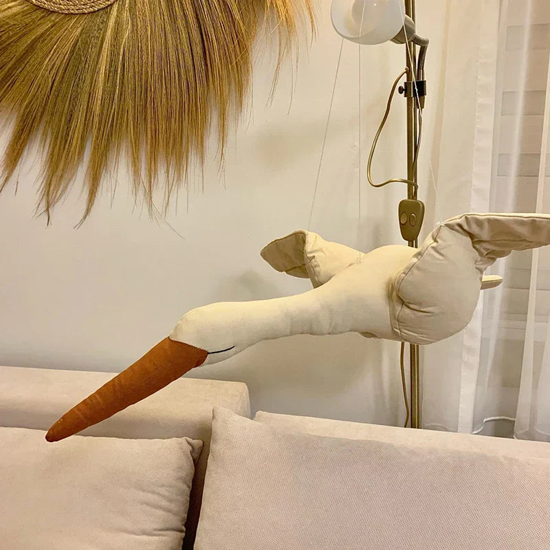 Handmade fabric swan nursery decor with attached ribbon, a lovely baby gift for wall display.