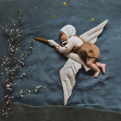 White plush swan with a delicate design, perfect addition to baby room decor or as a soft decorative pillow.