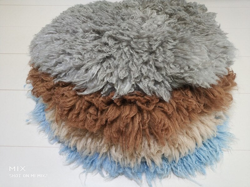 Hypoallergenic wool baby blanket, a safe and soft newborn photography prop.