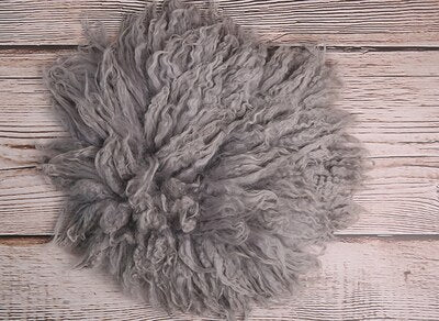 Creamy newborn wool blanket, perfect photography prop for infant photo shoots.