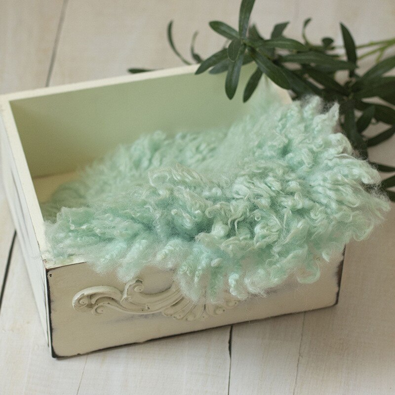 Textured wool baby blanket, soft photo backdrop for newborn photography studio.