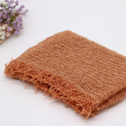 Knitted wool swaddle blanket, ideal baby photography prop and comfortable infant wrap for studio shoots.