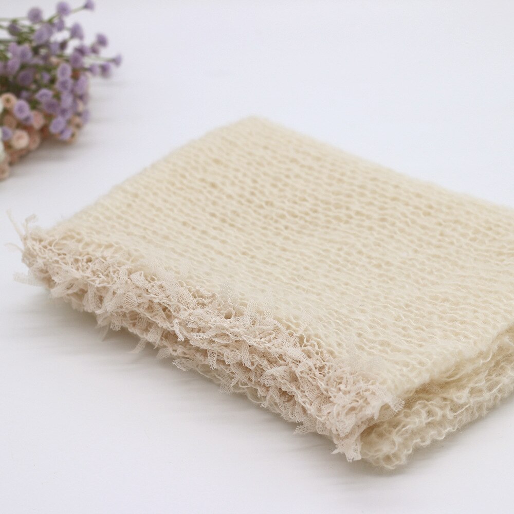 Cream wool swaddle blanket, a comfortable newborn prop, excellent for baby photography backdrops.