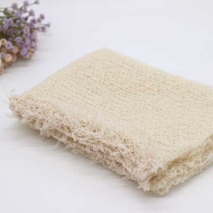 Cream wool swaddle blanket, a comfortable newborn prop, excellent for baby photography backdrops.