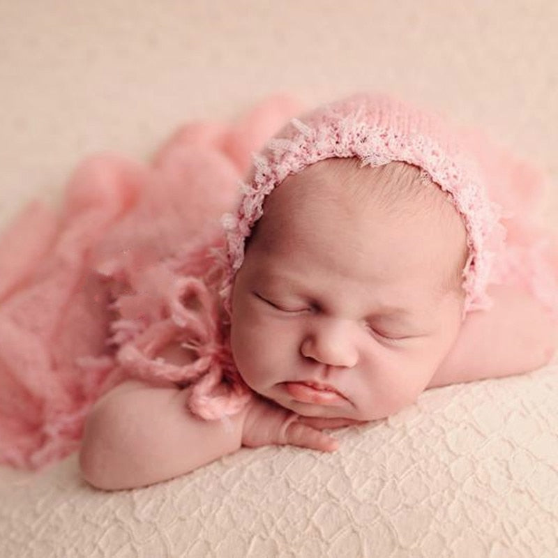 Handmade wool swaddle blanket, a premium newborn photography prop, comfortable for infant photo shoots.