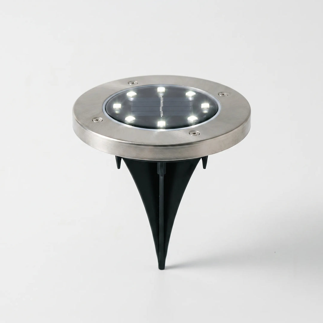 Robust waterproof solar garden disk lights for outdoor ground lighting.
