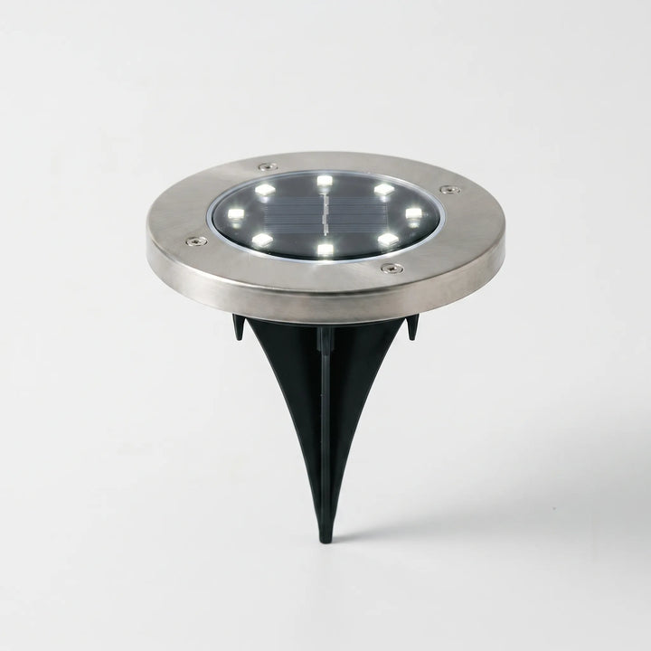 Robust waterproof solar garden disk lights for outdoor ground lighting.