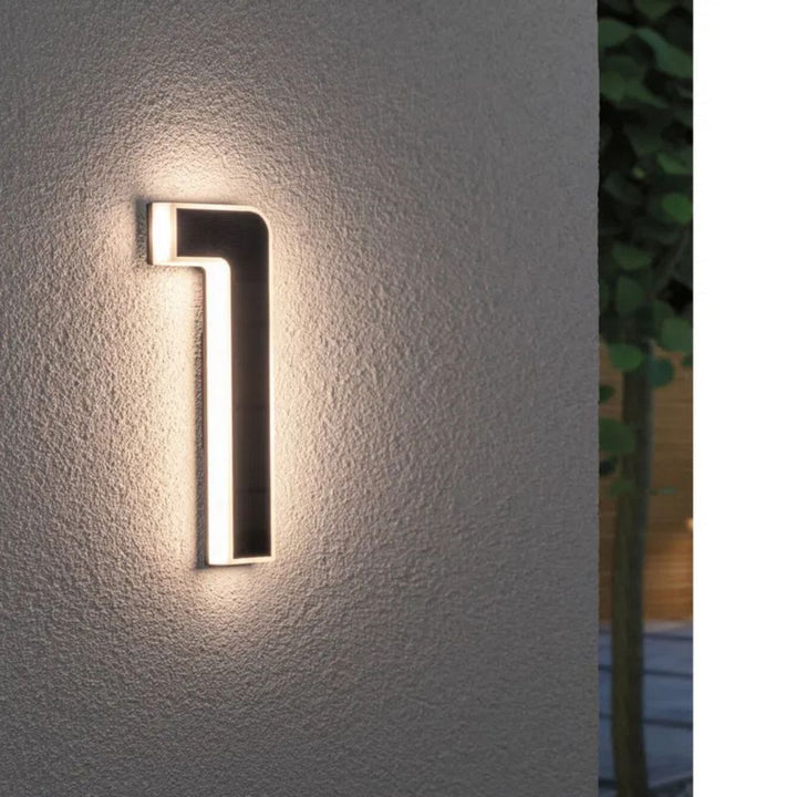 Modern LED address light, weather resistant, perfect for home exterior.