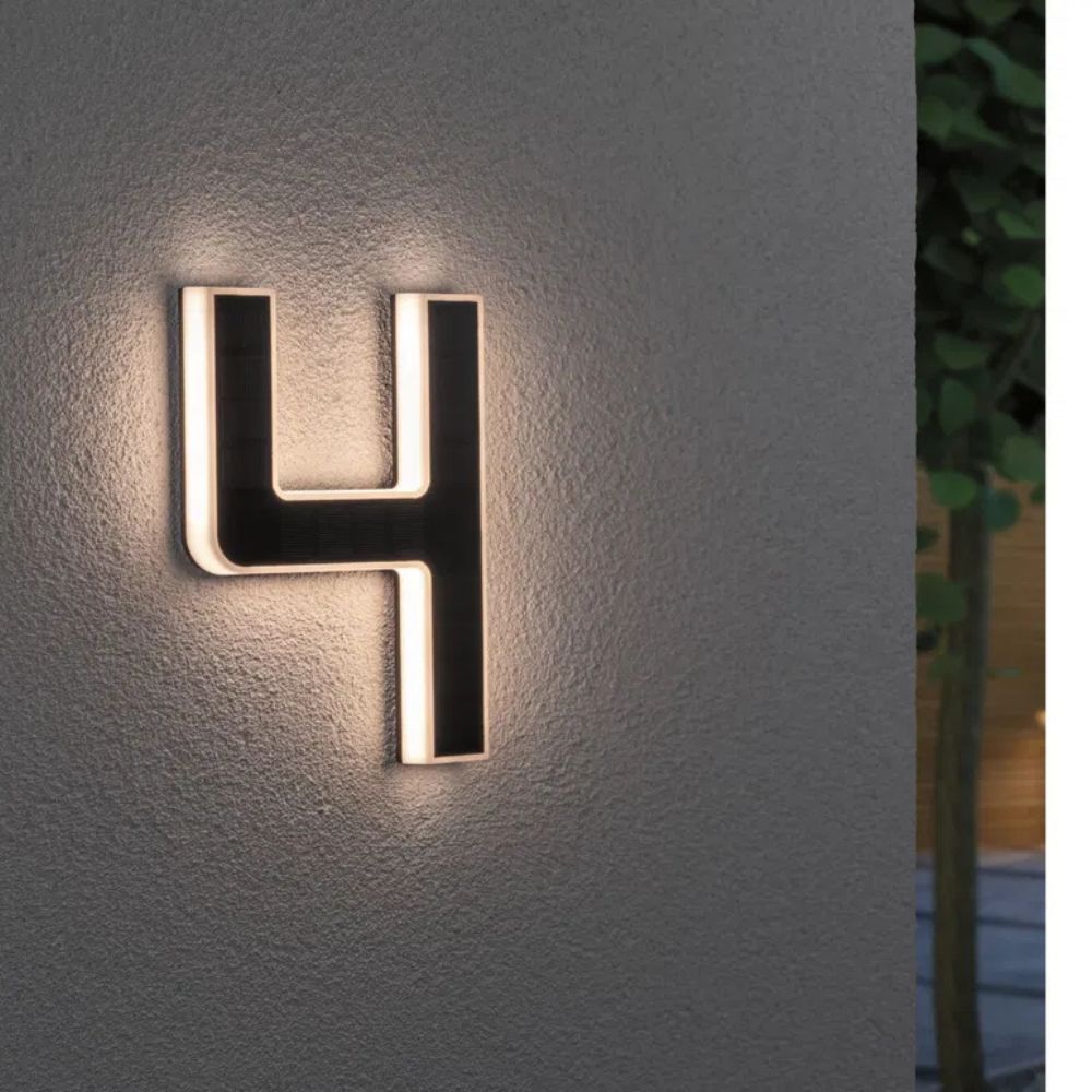 Bright LED house number sign, solar powered for a modern home exterior.