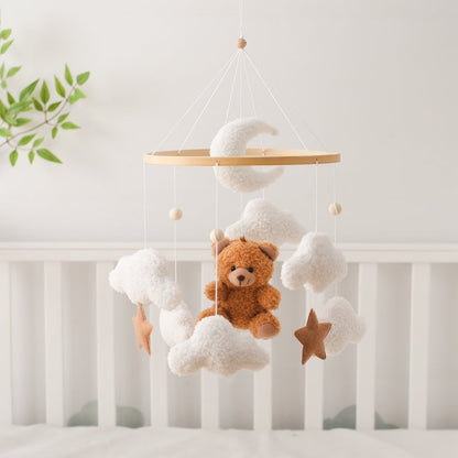 Soothing bear and stars baby mobile for crib, a nursery accessory and sensory toy.