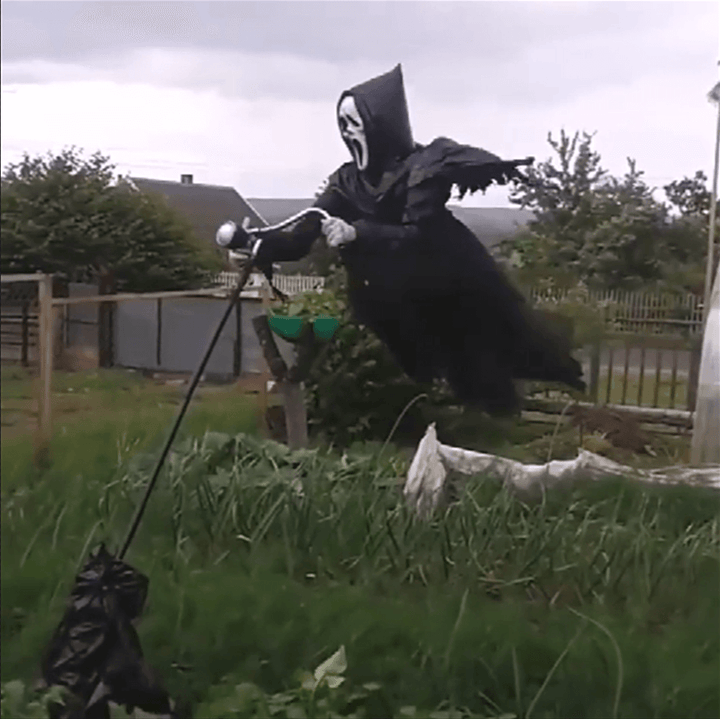 Detailed hanging ghost scarecrow Halloween decoration, featuring skeletal hands and tattered fabric