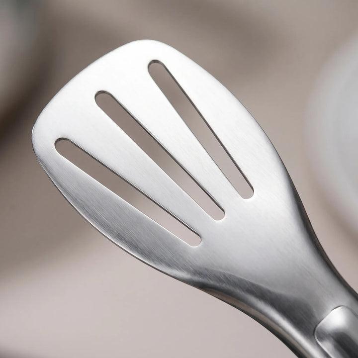 Slotted stainless steel BBQ tongs for grilling meats & vegetables. Locking mechanism, heat-resistant, easy grip.