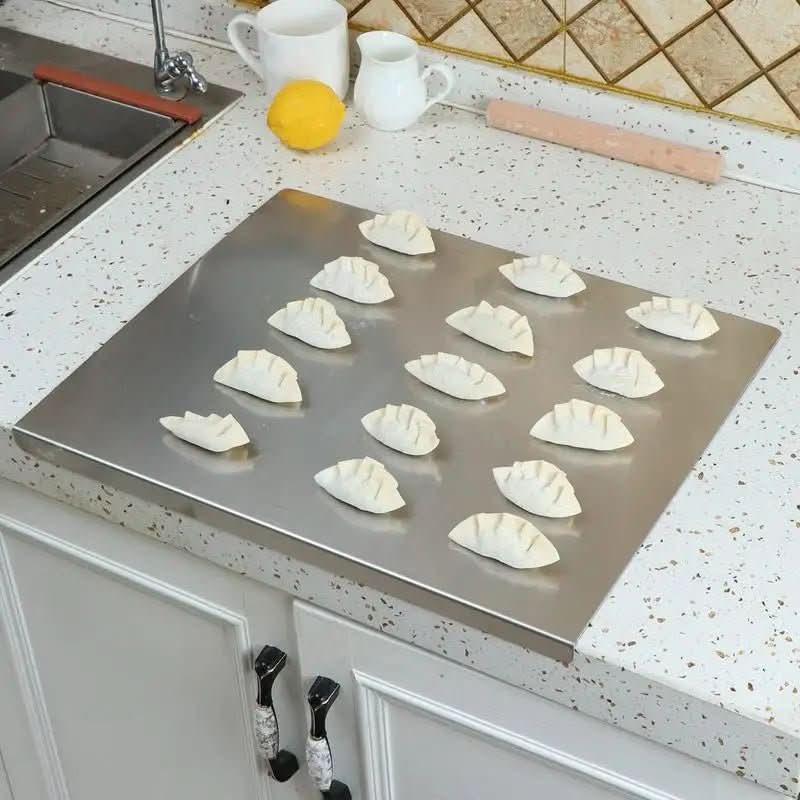 Sleek SteelCut Pro stainless steel cutting board, non-slip base, perfect for modern hygienic kitchen food prep.