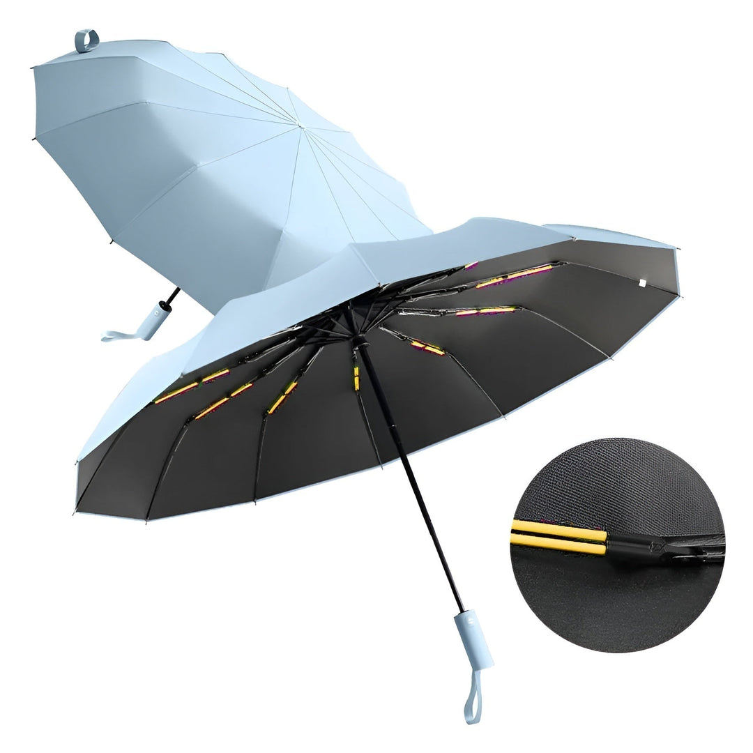 Person holding StormShield compact umbrella, demonstrating its portable size & ease of use.
