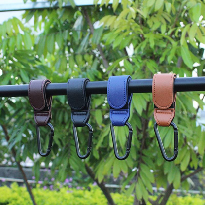 Stylish and practical black vegan leather stroller hooks for carrying groceries and baby items.