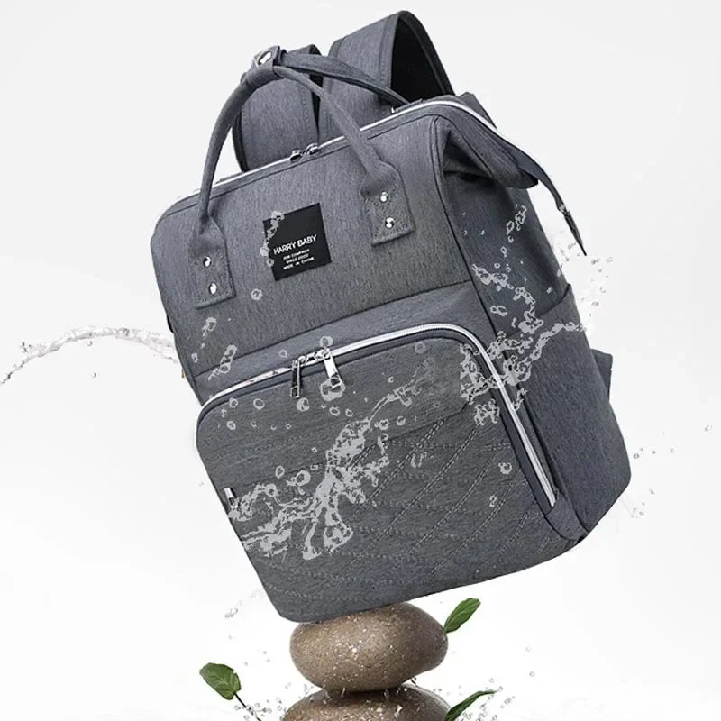 Fashionable mom with a designer diaper bag, essential for baby transport