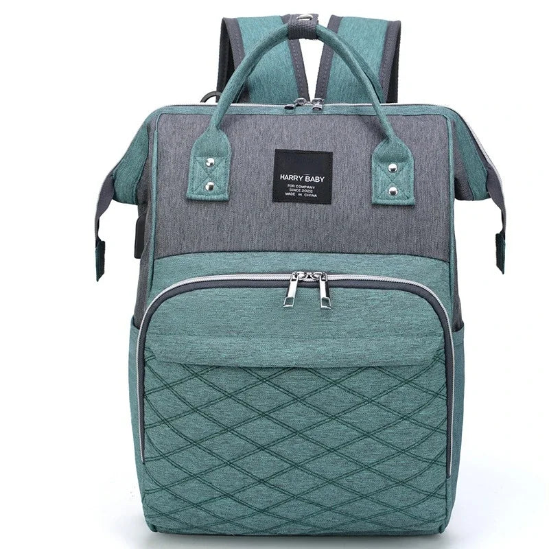 Diaper backpack in a stroller, showing its utility as an organized baby bag