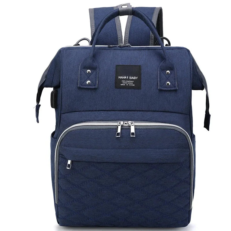 Maternity backpack with insulated bottle pockets, ideal for baby care on the go