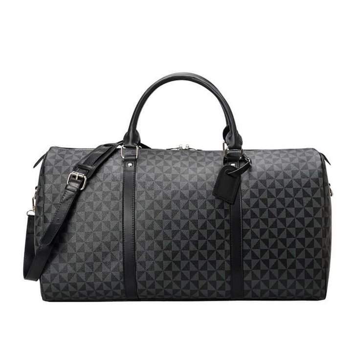 Black unisex duffle bag on a luggage rack, ready for a weekend getaway or as a stylish carry-on travel accessory.