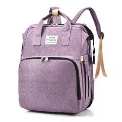 Portable nursery diaper bag for moms, with integrated changing pad and roomy compartments.